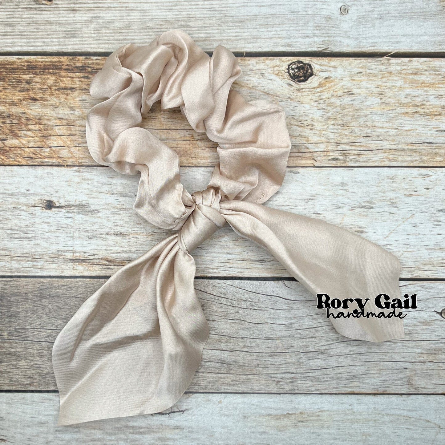 Rory Gail Handmade Satin Knotted Bow Scrunchie in the color, Cream