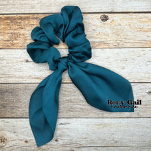 Load image into Gallery viewer, Rory Gail Handmade Satin Knotted Bow Scrunchie in the color, Deep Teal
