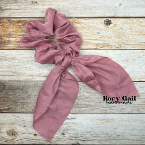 Rory Gail Handmade Satin Knotted Bow Scrunchie in the color, Mauve