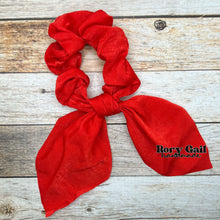 Load image into Gallery viewer, Rory Gail Handmade Satin Knotted Bow Scrunchie in the color, Candy Apple Red
