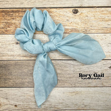 Load image into Gallery viewer, Rory Gail Handmade Satin Knotted Bow Scrunchie in the color, Pastel Blue
