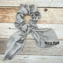 Load image into Gallery viewer, Rory Gail Handmade Satin Knotted Bow Scrunchie in the color, Silver
