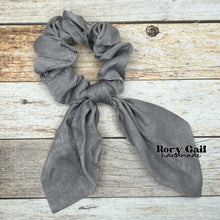 Load image into Gallery viewer, Rory Gail Handmade Satin Knotted Bow Scrunchie in the color, Grey
