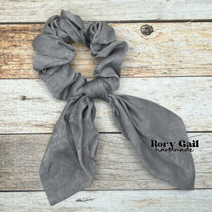 Rory Gail Handmade Satin Knotted Bow Scrunchie in the color, Grey