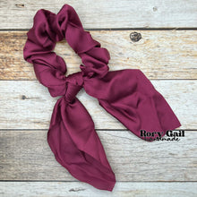 Load image into Gallery viewer, Rory Gail Handmade Satin Knotted Bow Scrunchie in the color, Plum
