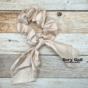 Rory Gail Handmade Satin Knotted Bow Scrunchie in the color, Cream